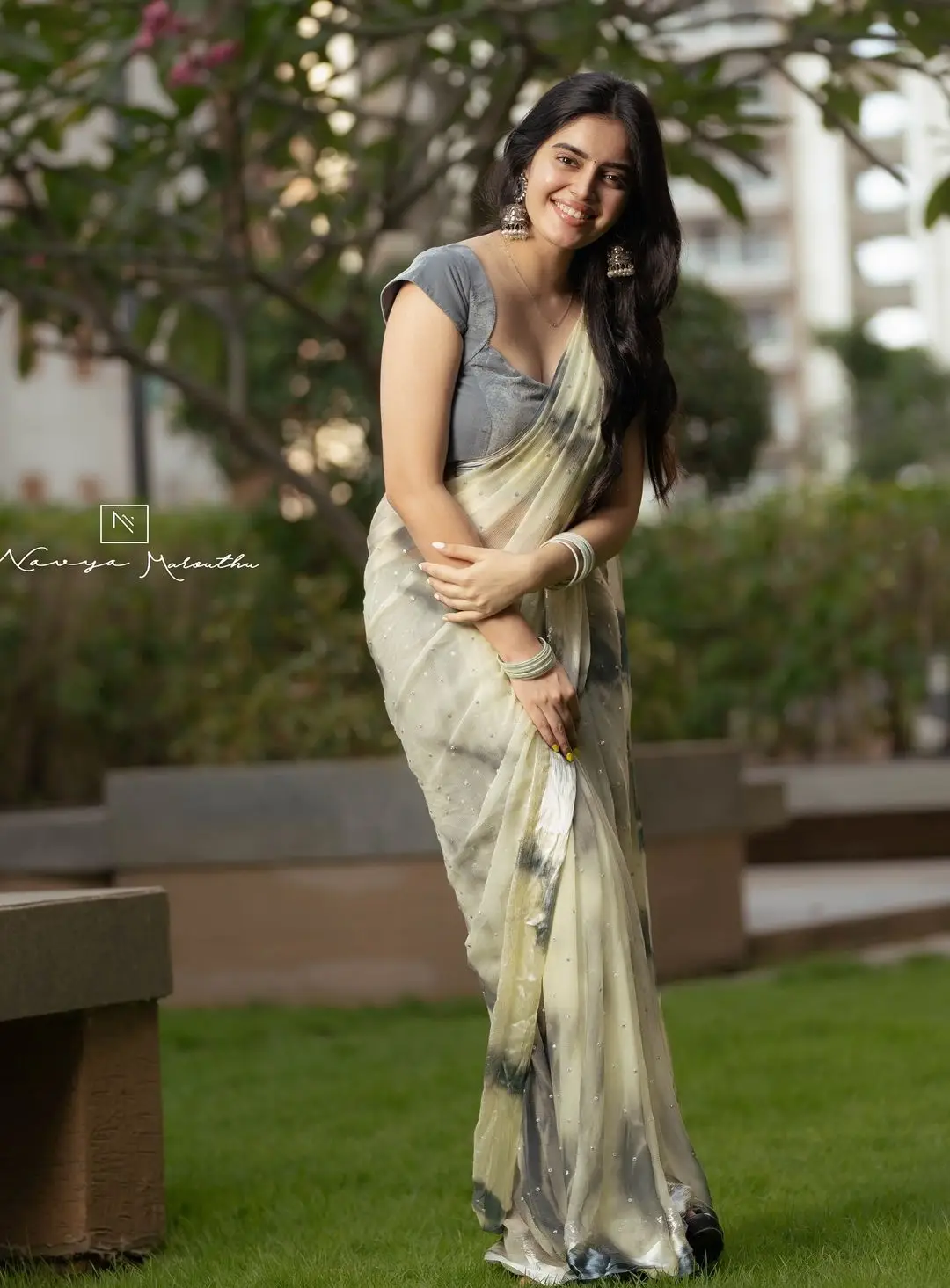 Navya Marouthu Wearing White Saree Sleeveless Black Blouse